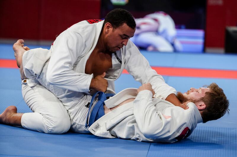 epa06970709 Faisal Alketbi of United Arab Emirates (R) competes against Zaid Sami of Jordan (L) during the men's 94 kg Ju-Jitsu gold medal match of the 18th Asian Games Jakarta-Palembang 2018 in Jakarta, Indonesia, 25 August 2018.  EPA/ADI WEDA
