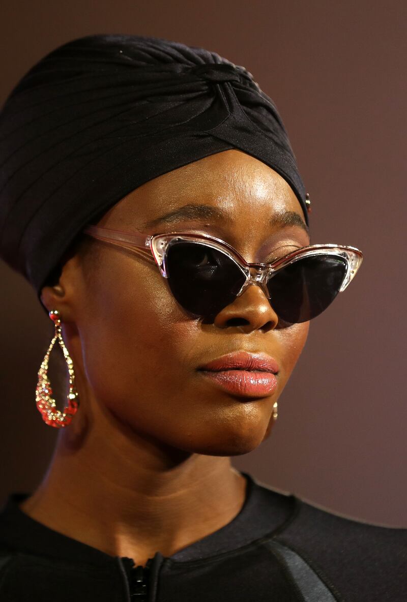 A model sports Coega Sunwear and statement sunglasses.