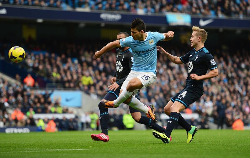 MANCHESTER, ENGLAND - NOVEMBER 24:  Sergio Aguero of Manchester City shoots at goal under pressure from Lewis Holtby of Tottenham Hotspur during the Barclays Premier League match between Manchester City and Tottenham Hotspur at Etihad Stadium on November 24, 2013 in Manchester, England.  (Photo by Jamie McDonald/Getty Images)