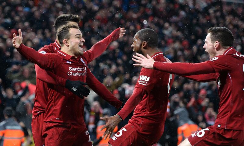 epa07235973 Xherdan Shaqiri (L) of Liverpool celebrates after scoring together with his teammates during the English Premier League soccer match between Liverpool FC and Manchester United FC at Anfield in Liverpool, Britain, 16 December 2018.  EPA/PETER POWELL EDITORIAL USE ONLY. No use with unauthorized audio, video, data, fixture lists, club/league logos or 'live' services. Online in-match use limited to 120 images, no video emulation. No use in betting, games or single club/league/player publications.