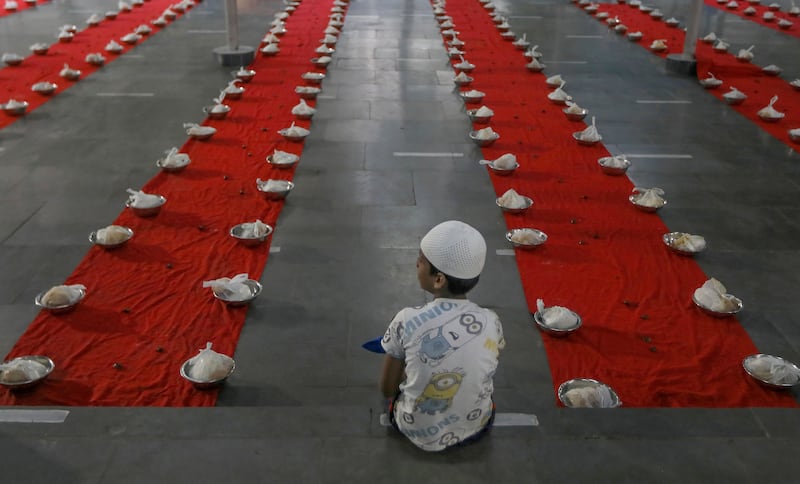 A young worshipper waits to break his day-long fast in the southern Indian city of Hyderabad. AP