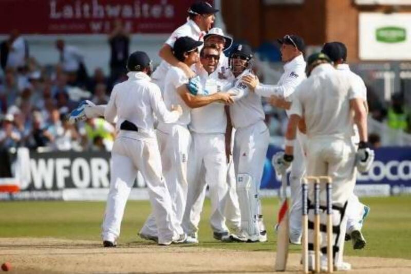 England's Graeme Swann and teammates celebrate the wicket of Australia's Steve Smith. Darren Staples / Reuters
