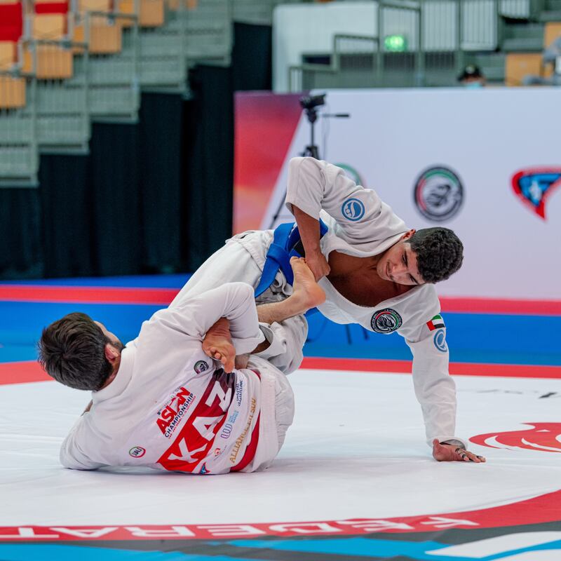 Theyab Al Nuaimi, right, on his way to victory over Kazakh Nurzhan Seiduali in the Jiu-Jitsu Asian Championship in Abu Dhabi. Courtesy UAEJJF