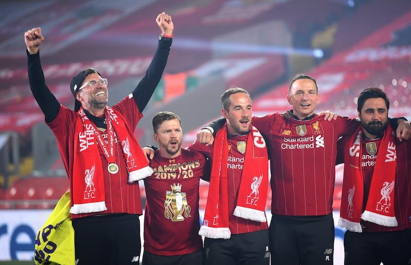 Manager Jurgen Klopp celebrates with members of his backroom staff. Getty