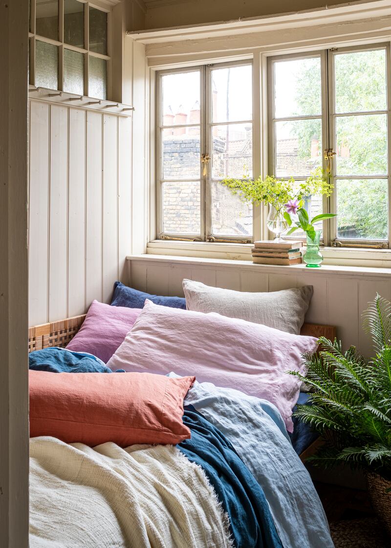 Cushions and throws should be piled up high for maximum effect. Photo: Piglet in Bed