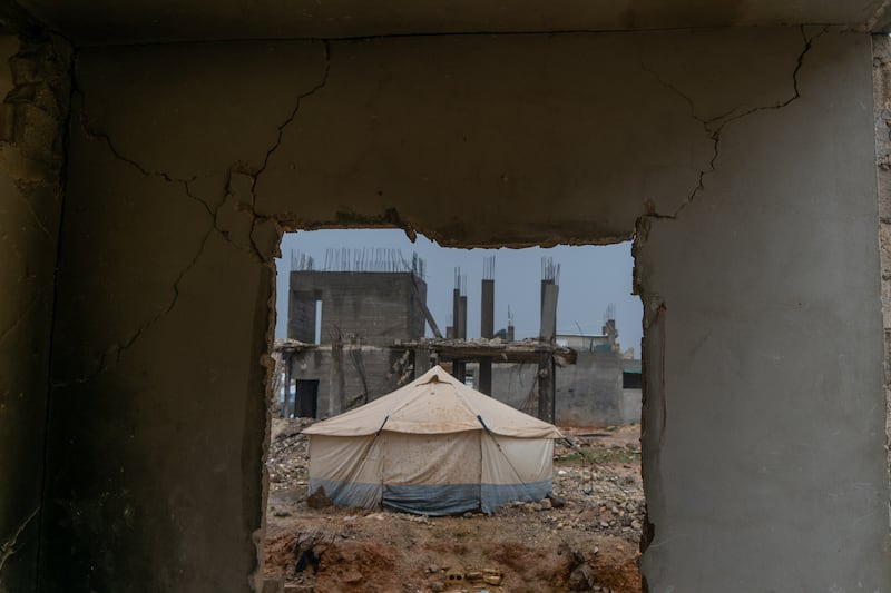 A family’s tent, surrounded by rubble, in the town of Jindires, in Aleppo province, north-west Syria. A year on from the 7.8 magnitude earthquake that devastated parts of southern Turkey and northern Syria on February 6, 2023, some Syrians are still living in makeshift accommodation. All photos: Moawia Atrash for the National