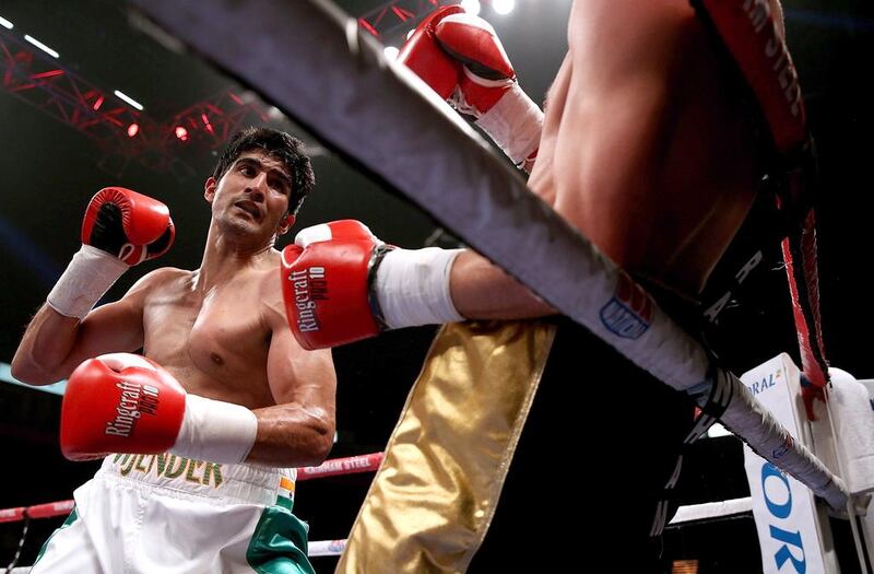 Vijender Singh, left, of India and Sonny Whiting of Great Britain exchange blows during their International Middleweight contest at Manchester Arena on October 10, 2015 in Manchester, England. (Photo by Ben Hoskins/Getty Images)