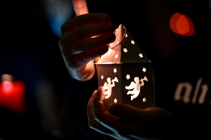 Greek Orthodox Christians light candles with the 'Holy Fire' in  Beirut. EPA