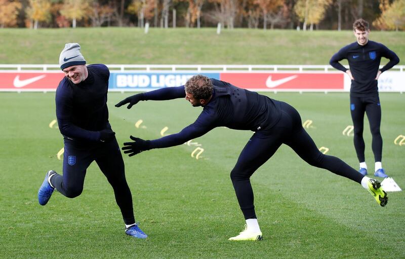 Wayne Rooney and Kyle Walker share a laugh during training. Reuters