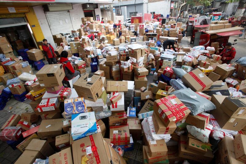 Employees sort boxes and parcels at a JD.com logistic station, after the Singles Day online shopping festival, in Xi'an, Shaanxi province, China November 13, 2017. Picture taken November 13, 2017. REUTERS/Stringer ATTENTION EDITORS - THIS IMAGE WAS PROVIDED BY A THIRD PARTY. CHINA OUT.
