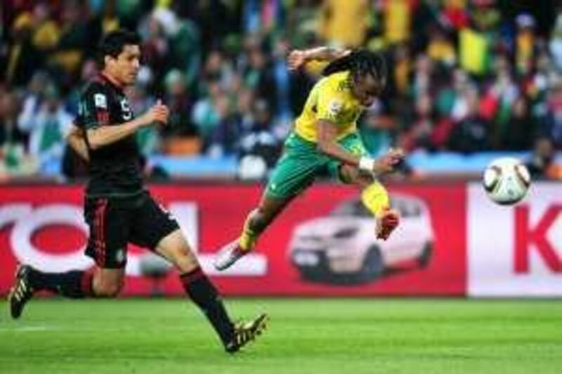JOHANNESBURG, SOUTH AFRICA - JUNE 11:  Siphiwe Tshabalala of South Africa scores the first goal during the 2010 FIFA World Cup South Africa Group A match between South Africa and Mexico at Soccer City Stadium on June 11, 2010 in Johannesburg, South Africa.  (Photo by Clive Mason/Getty Images) *** Local Caption ***  GYI0060713703.jpg