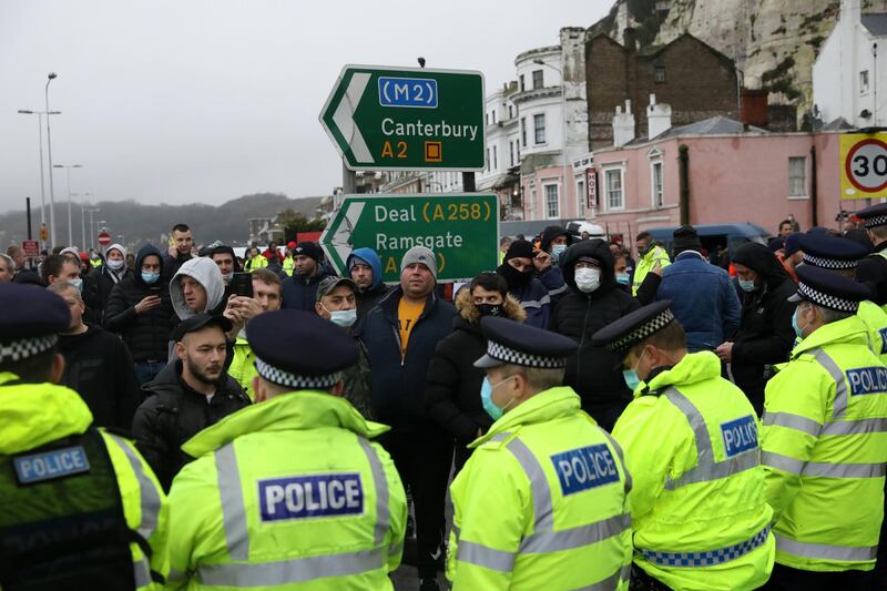 Travellers to Europe are stopped by police officers at the Port of Dover in Dover, United Kingdom. Nearly 3,000 lorries were stranded around Kent after France banned all travel from the UK on Sunday, citing concerns over a new variant of covid-19. Late Tuesday, the countries reached a deal to restart freight travel for drivers with a recent negative covid-19 test. Getty Images