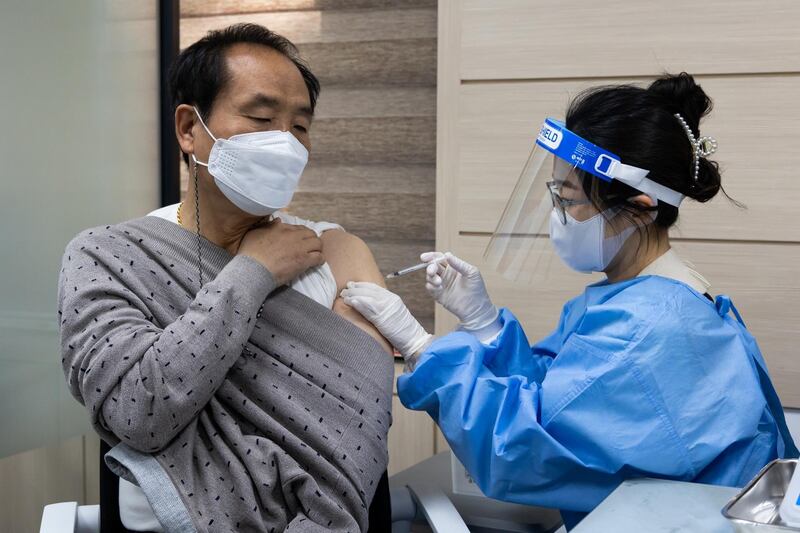 A nurse administers a dose of the AstraZeneca Covid-19 vaccine at the Nowon District public health centre in Seoul, South Korea. The country resumed inoculations with the AstraZeneca shot this week after a suspension, but will limit use to those between 30 and 60 years old. Bloomberg