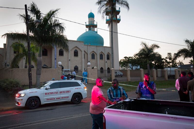epa06726298 Police officers stand outside the Imam Hussain Mosque where three members of the clergy where attacked with knives, hours earlier, in Durban, South Africa, 10 May 2018. Reports state that the attackers are believed to be three Egyptian nationals, who allegedly slit the throats of the three people, including the Imam of the mosque. A man died in hospital due to significant injuries while two others remain in a critical condition.  EPA/STR