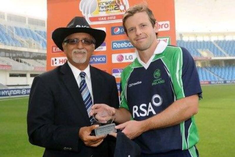 Ireland's Ed Joyce, right, is presented with the player of the match award by match referee, Dev Govindjee for his superb innings against Scotland.