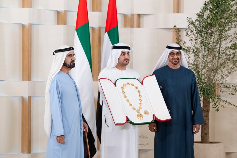 President Sheikh Mohamed and Sheikh Mohammed bin Rashid  present the Order of the Union to Sheikh Maktoum bin Mohammed, Deputy Prime Minister, Minister of Finance and First Deputy Ruler of Dubai