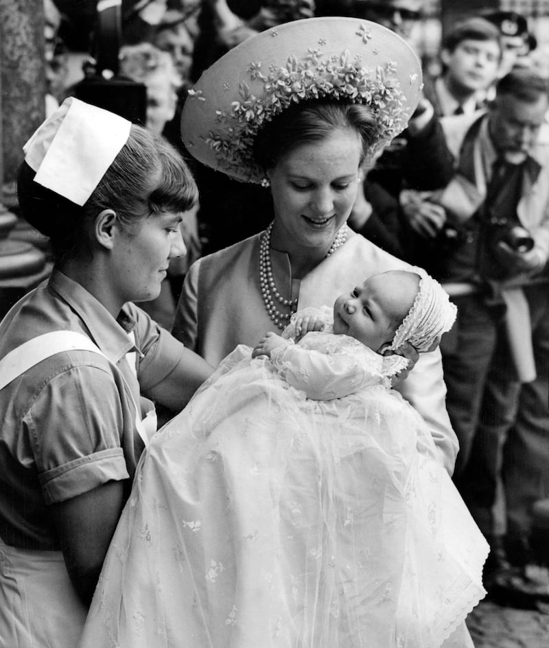 Crown Princess Margrethe with Prince Frederik during his baptism at Holmens Church in Copenhagen, 1968. EPA