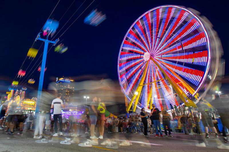 A Ferris wheel spins as the Canadian National Exhibition  reopens after a two year Covid-19 hiatus, in Toronto. Reuters