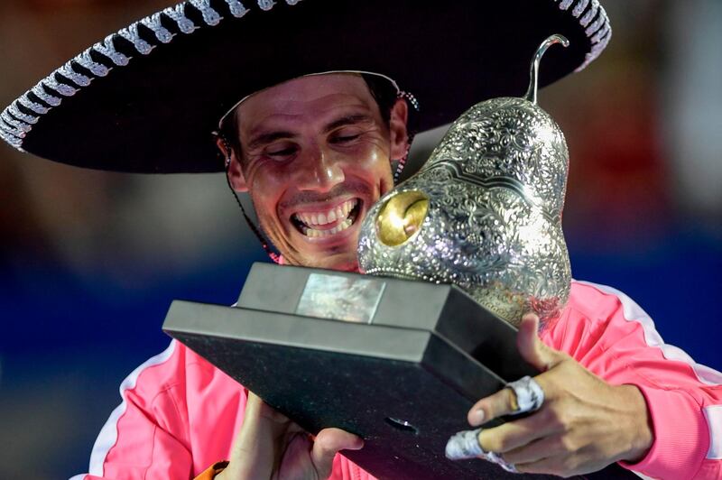 Spain's Rafael Nadal Rafael Nadal wearing a sombrero holds the trophy after winning the Mexican Tennis Open ATP final match against USA's Taylor Fritz during the Mexico ATP Open men's singles tennis final in Acapulco, Guerrero state on February 29, 2020. / AFP / PEDRO PARDO
