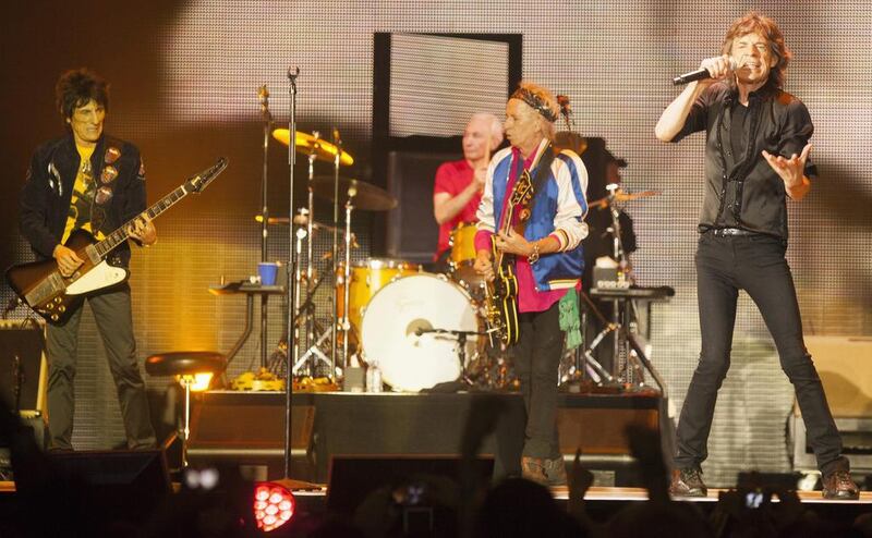 Ronnie Wood, Charlie Watts, Keith Richards and Mick Jagger of British band The Rolling Stones perform at a sold out concert in Macau, China, 09 March 2014. Alex Hofford / AFP