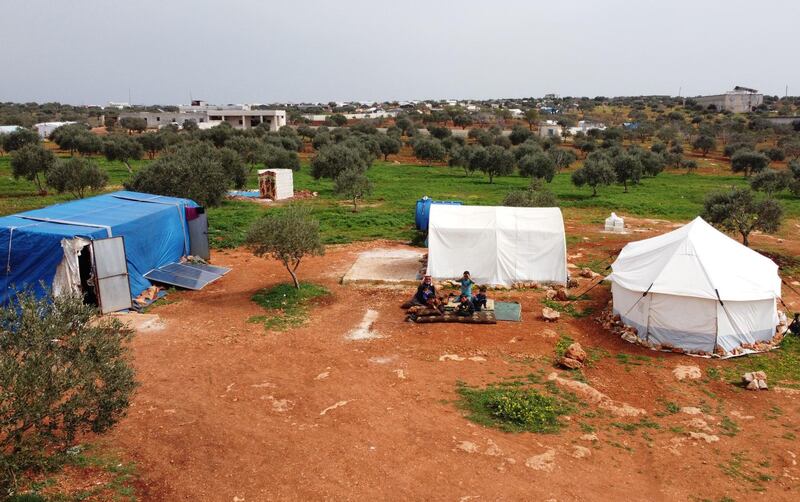 An aerial view of an encampment in the village of Harbanoush where Abderrazaq Khatoun lives with his 11 orphaned grandchildren and other family members. AFP