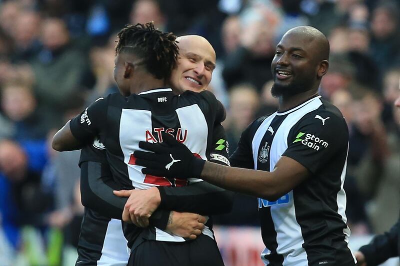 Newcastle United's English midfielder Jonjo Shelvey (C) celebrates with teammates after scoring his team's second goal. AFP