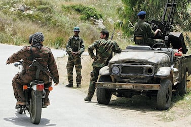 An archive picture of Palestinian guerillas from the Popular Front for the Liberation of Palestine-General Command manning an anti-aircraft gun after Israeli warplanes attacked their base, near the Mediterranean coastal town of Naameh, south of Beirut, Lebanon. in 2006. AP