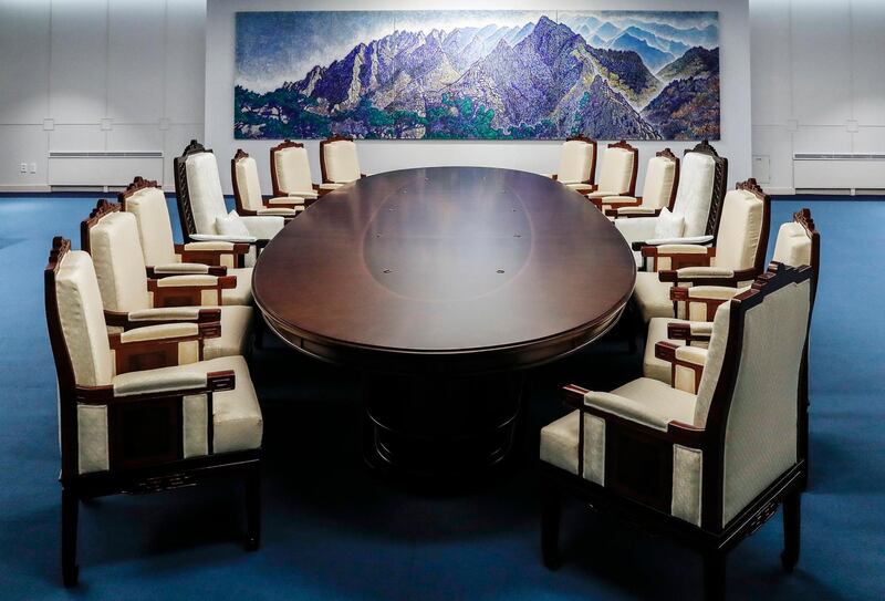 This April 23, 2018, photo provided by South Korea Presidential Blue House on Wednesday, April 25, 2018, shows a meeting room for the April 27 summit between South and North Korea at the Peace House at the southern side of the Panmunjom in the Demilitarized Zone, South Korea.  Kim Jong Un will be in unchartered territory when the third-generation autocrat crosses over to the southern half of the Demilitarized Zone separating the rival Koreas on April 27, possibly on foot, and greets South Korean President Moon Jae-in.  (South Korea Presidential Blue House via AP)