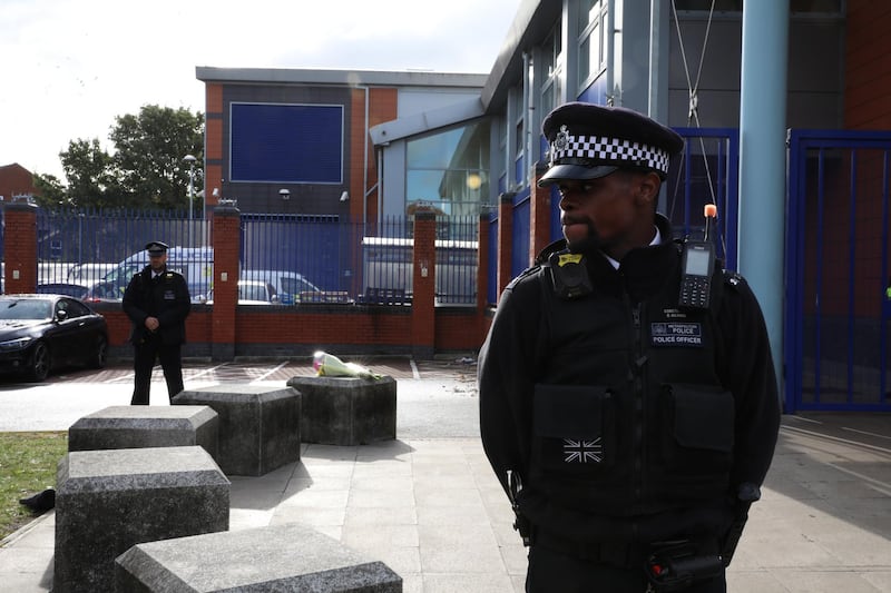 LONDON, ENGLAND - SEPTEMBER 25: A police officer stands guard at Croydon Custody Centre on September 25, 2020 in the Croydon area of London, England. A murder investigation has been launched following the death of a police officer at the Croydon Custody Centre in south London. He was shot by a 23-year-old man who was also treated for a gunshot wound. The officer died later in hospital. The death will be investigated by the  Independent Office for Police Conduct. (Photo by Dan Kitwood/Getty Images)