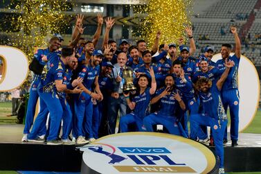 Mumbai Indians team players hold the trophy as they celebrate their victory against Chennai Super Kings in the final of the 2019 Indian Premier League in Hyderabad. AFP