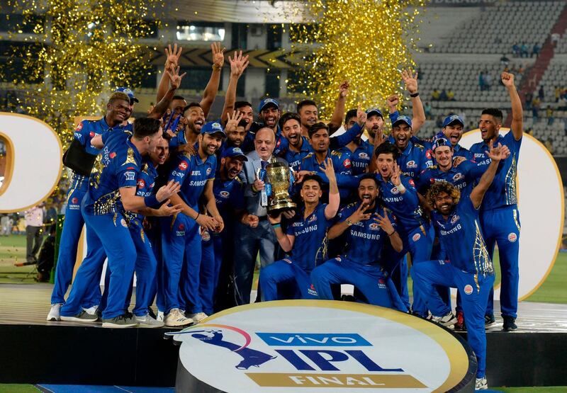 (FILES) In this file photo taken on May 13, 2019, Mumbai Indians team players hold the trophy as they celebrate their victory against Chennai Super Kings after the 2019 Indian Premier League (IPL) Twenty20 final cricket match at the Rajiv Gandhi International Cricket Stadium in Hyderabad. Already regarded as the world's richest and most successful Twenty20 team, the Mumbai Indians will attempt to underline their status by claiming their first back-to-back titles in the Indian Premier League. - ----IMAGE RESTRICTED TO EDITORIAL USE - STRICTLY NO COMMERCIAL USE----- 
 / AFP / NOAH SEELAM / ----IMAGE RESTRICTED TO EDITORIAL USE - STRICTLY NO COMMERCIAL USE----- 
