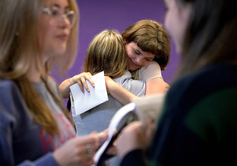 Pupils congratulate each other after receiving their GCSE results at Roedean School in Brighton, on Thursday. PA