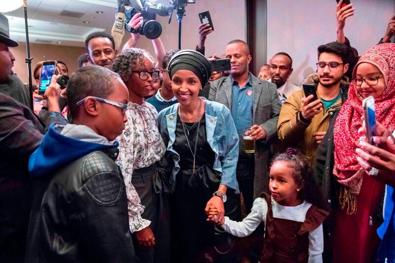 Omar, centre, arrives for her victory party on election night. AFP