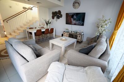 The spacious living room of the Dubai Hills townhouse. Chris Whiteoak / The National