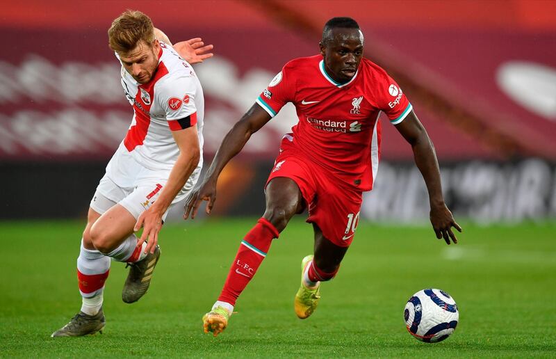 Liverpool's Sadio Mane under pressure from Stuart Armstrong of Southampton. EPA