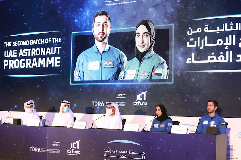 Saeed Al Kormastaji, UAE astronaut office manager (L), Salem Al Marri, UAE Astronaut Programme manager and Yousuf Al Shaibani, director general of MBRSC (M). with the UAE's new astronauts, Nora Al Matrooshi and Mohammed Al Mulla at the Address Hotel, Dubai Mall in Dubai