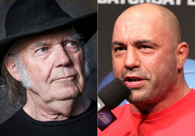 Spotify has announced it will add a new content advisory after musicians including Neil Young, left, removed their music over a podcast by Joe Rogan. AP