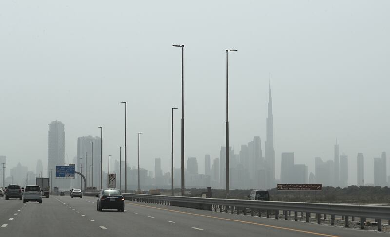 A hot and dusty day in downtown Dubai. Temperatures in one desert region hit 50°C on Sunday, while the cities sweltered in 45°C heat. Pawan Singh / The National