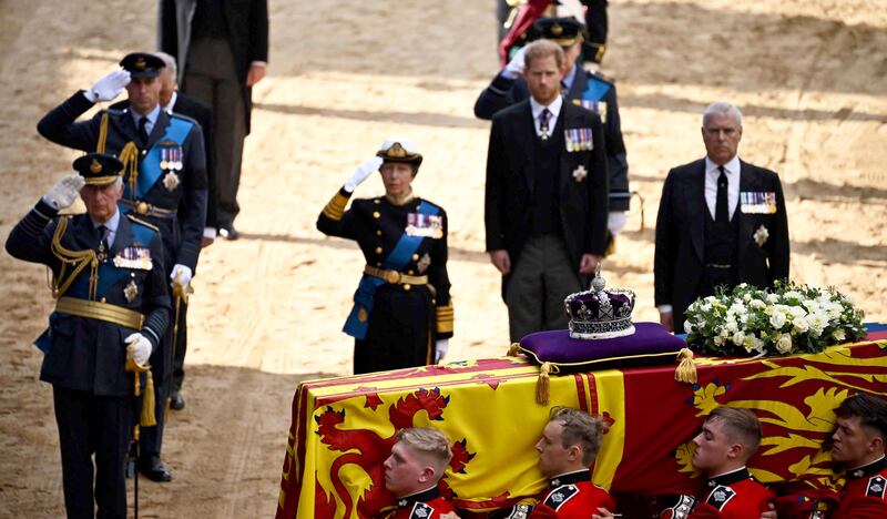 King Charles III, Prince William and Princess Anne salute alongside Prince Harry and Prince Andrew, as the coffin of Queen Elizabeth II arrives at the Palace of Westminster, following a procession from Buckingham Palace. AFP