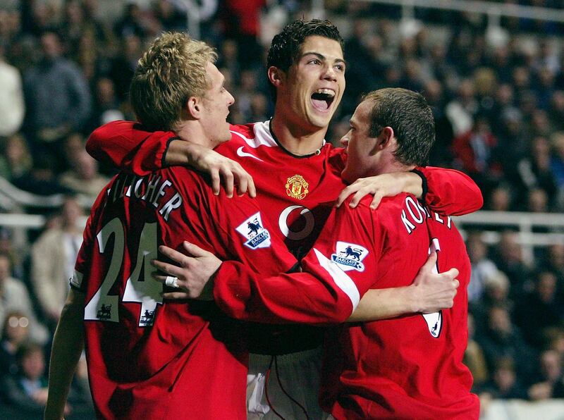 NEWCASTLE, ENGLAND - NOVEMBER 14:  Wayne Rooney of Manchester United celebrates his goal with Darren Fletcher and Cristiano Ronaldo during the Barclays Premiership match between Newcastle United and Manchester United at St James' Park on November 14 , 2004 in Newcastle, England. (Photo by Alex Livesey/Getty Images)