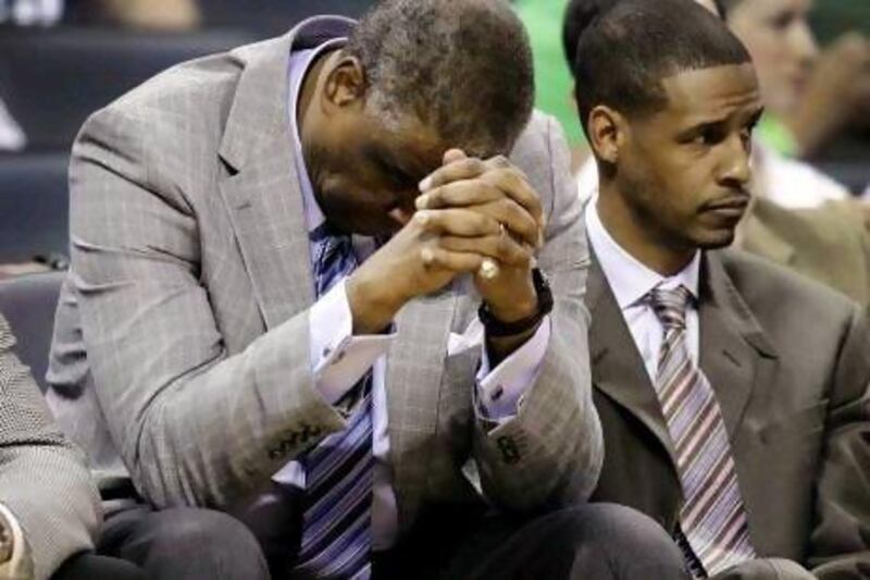 Paul Silas, left, the Charlotte Bobcats head coach, lowers his head during their defeat to an understrength Boston Celtics side on Sunday. Chuck Burton / AP Photo