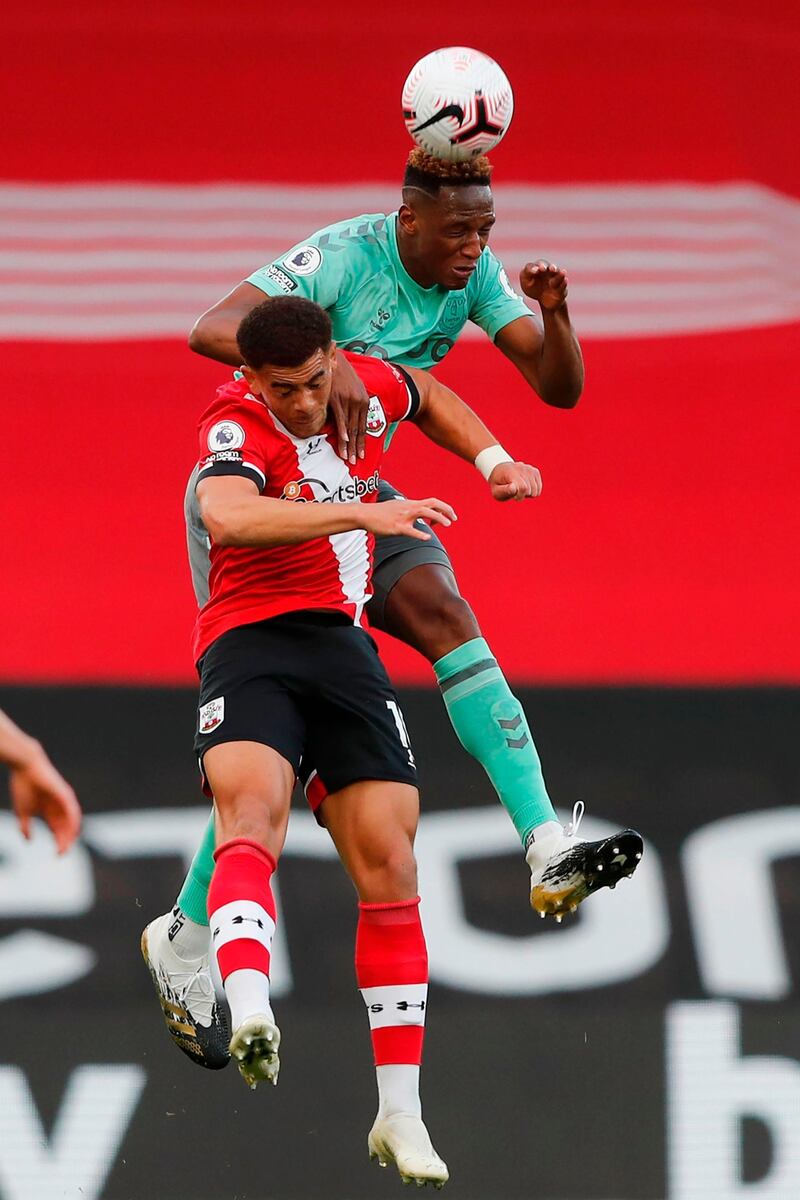 Southampton's midfielder Che Adams vies for the ball with Everton's defender Yerry Mina. AFP
