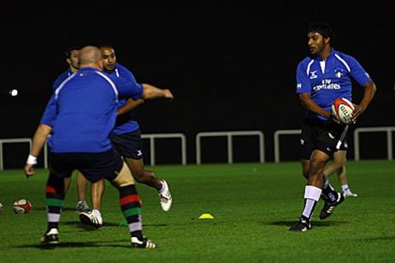 Mohannad Shaker, right, trains with the national team last night in Dubai. The Emirati will be among the replacements on Saturday.