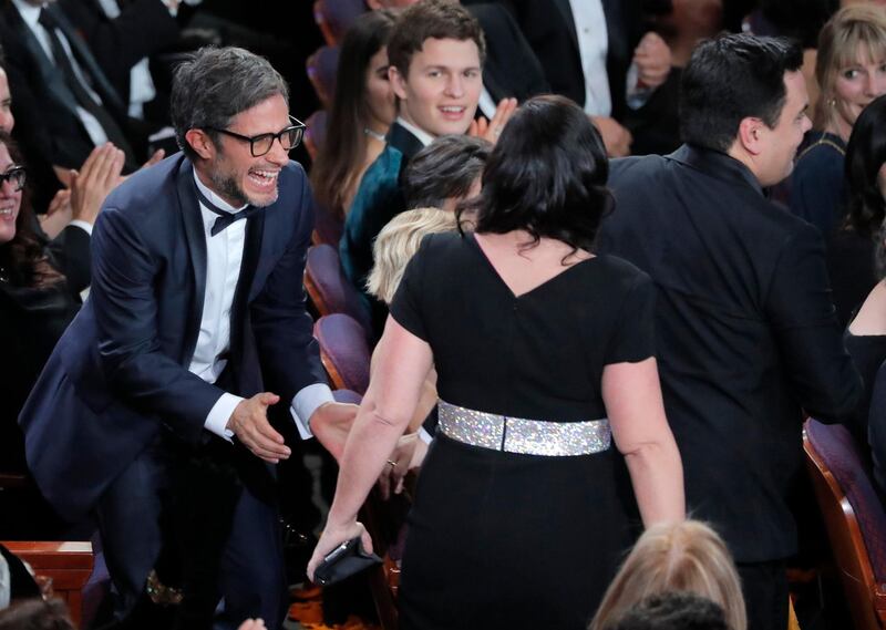 Gael Garcia Bernal looks delighted as Kristen Anderson-Lopez and Robert Lopez win the Oscar for Best Original Song, 'Remember Me,' from 'Coco.' Ansel Engort appears to be suffering from 'FOMO'. Reuters