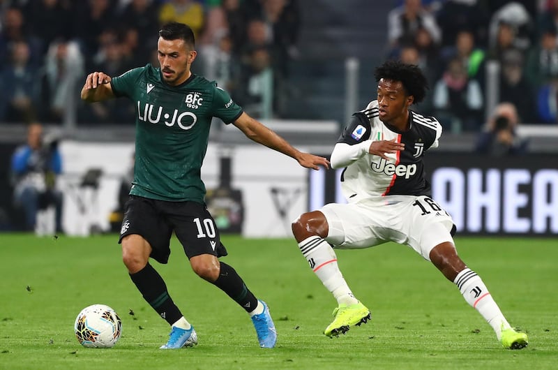 Nicola Sansone of Bologna FC competes for the ball with Juan Cuadrado of Juventus FC during the Serie A match between Juventus and Bologna FC at Allianz Stadium in Turin, Italy. Getty Images