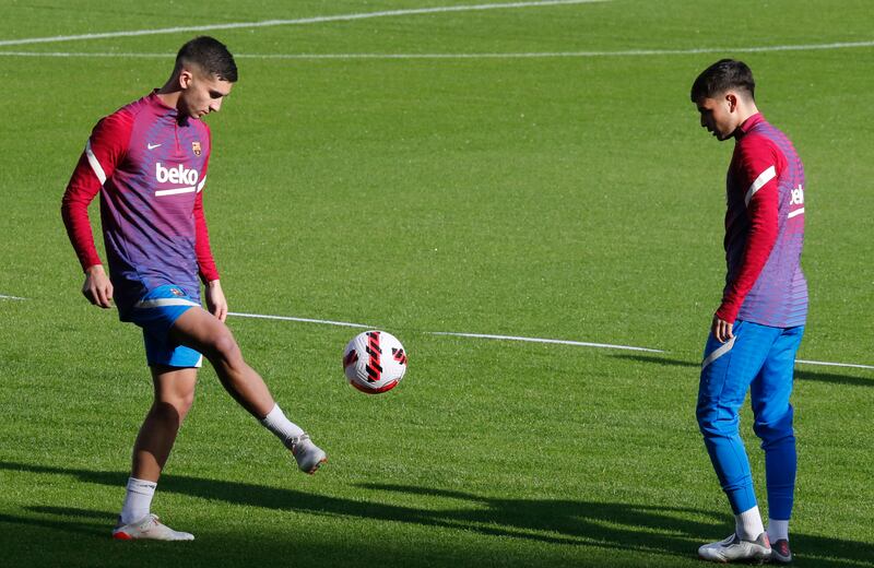 Barcelona's Ferran Torres and Pedri during training. Reuters