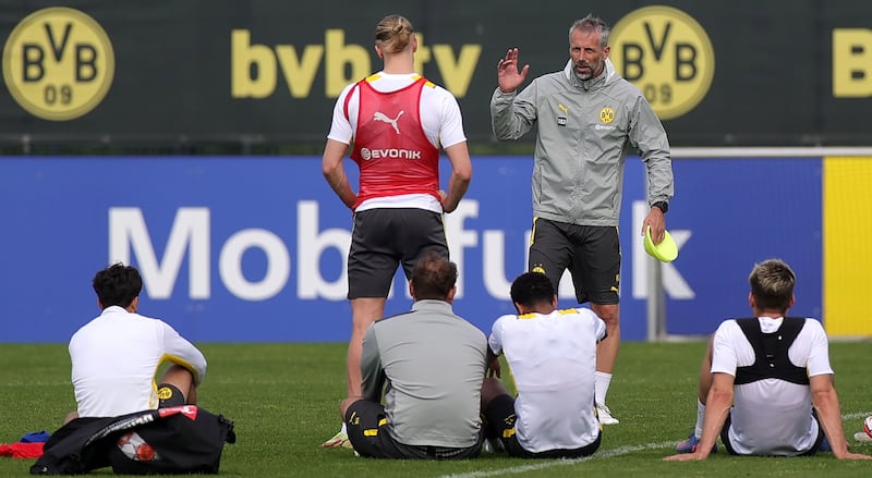 Dortmund's manager Marco Rose talks to Erling Haaland during training. EPA