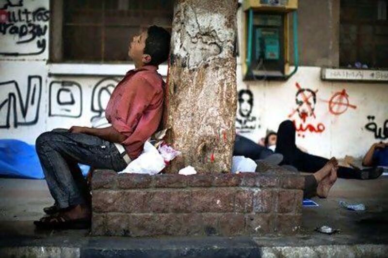 A youth sleeps in Cairo's Tahrir Square. Youth unemployment in the region stands at 25 per cent and is expected to rise. Marco Longari / AFP