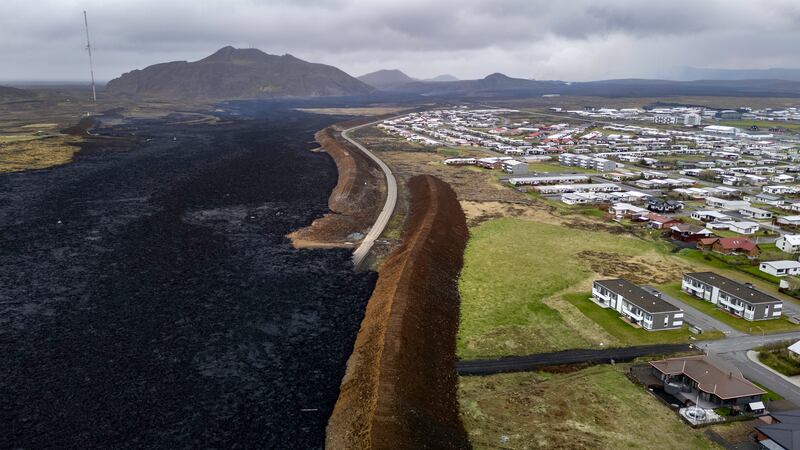 Earthen berms protect the town of Gridavik from lava after a volcano erupted for the fifth time since December on the Reykjanes peninsula, Iceland. Getty Images