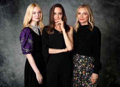 Cast members Elle Fanning (L), Angelina Jolie (C) and Michelle Pfeiffer pose for a portrait while promoting the film "Maleficent: Mistress of Evil" in Beverly Hills, California, U.S., September 29, 2019. REUTERS/Mario Anzuoni
